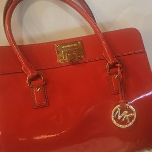 Red Michael Kors bag.